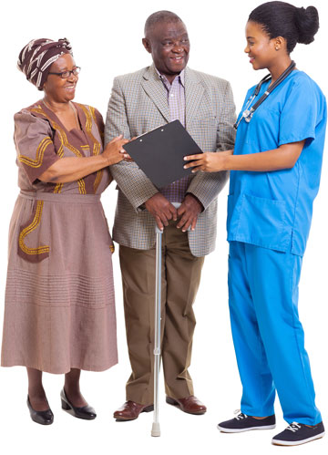 A doctor showing a couple a document on a clipboard